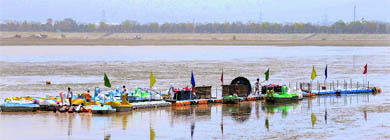 CITCO workers shift jetties to a new place following low water level in Sukhna Lake on Monday. 