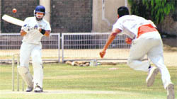 A batsman of Patiala team hits a ball during the Inter-District Cricket Tournament in Patiala on Monday. 