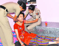 Vishu Tanwar, whose husband committed suicide on Sunday, being consoled by her colleagues at her residence in Sector 29, Chandigarh, on Monday.