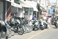 The encroachments on a road by old vehicles dealers near Ali Mohalla in Ward 36 in Jalandhar. Photo: Sarabjit Singh