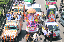 Devotees take part in a religious procession on Kabir Jayanti in Jammu on Monday. 