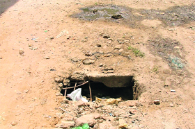 A view of an ill-maintained road in ward number 66.