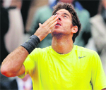 Juan Martin del Potro celebrates after winning his match against Tomas Berdych during the French Open at the Roland Garros stadium in Paris on Monday. Del Potro won 7-6(6), 1-6, 6-3, 7-5.  Reuters