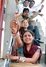 A newly-wed is among the protesting unemployed teachers who have climbed atop a watertank at Lehra Dhurkot village near Rampura Phul sub-division of Bathinda district on Tuesday