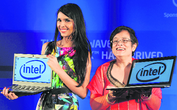 Intel South Asia MD (marketing) Debjani Ghosh (R) and a model display the newly launched Intel Ultrabooks with 3G Core processors in New Delhi on Tuesday.
