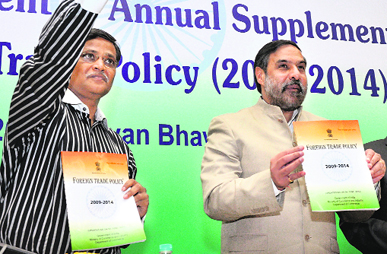 Commerce & Industry Minister Anand Sharma (R) with Director-General of Foreign Trade Anup K. Pujari releasing the 2012-13 annual supplement to the foreign trade policy in New Delhi on Tuesday.