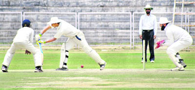 A batsman plays a shot during the Inter-District U-19 Cricket Tournament in Patiala.