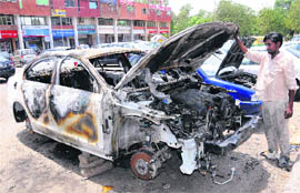 A view of the Volkswagen Jetta that was set afire at Sector 32 in Chandigarh on Monday night.