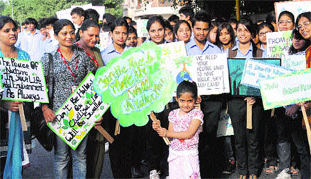 Members of the Environment Society of India take out a rally near the Sukhna Lake in Chandigarh on Tuesday. T