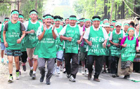 Tibetans participate in an awareness run on World Environment Day in Dehradun on Tuesday.