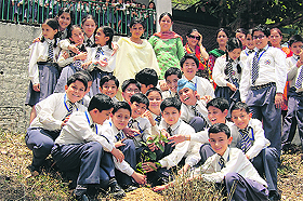 Students of Highland Public School plant a sapling on the school campus on World Environment Day in Dharamsala on Tuesday. 