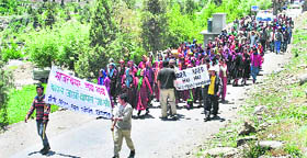 Activists of NGOs and mahila mandals hold a protest against power projects at Udaipur on World Environment Day on Tuesday. 
