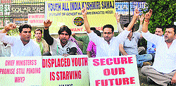 Members of the Youth of All India Kashmiri Samaj raise slogans to protest against the state government in Srinagar on Tuesday