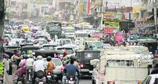 A long queue of vehicles stuck in a traffic jam on the Jalandhar-Hoshiarpur road as SAD leaders hold a rally at Rama Mandi in Jalandhar on Tuesday. 