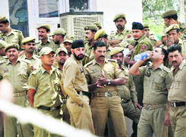 Security staff suspend work following a clash with medical staff at the GMCH in Jammu on Tuesday