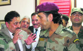 Team India skipper MS Dhoni interacts with Kiran Wattal, secretary, J&K State Sports Council, in Srinagar on Tuesday. 