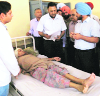 Doctors attend to a patient at the Ghanaur Civil Hospital.