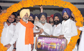 Deputy Chief Minister Sukhbir Singh Badal welcoming former Congress MLA Parkash Singh Bhatti to the SAD fold in Abohar on Wednesday.