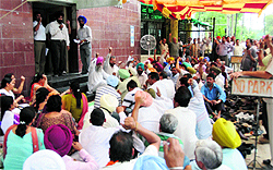 Trade union leaders address a gate rally during the day long dharna by BSNL employees in Ludhiana on Wednesday
