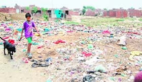 A child walks near a garbage dump