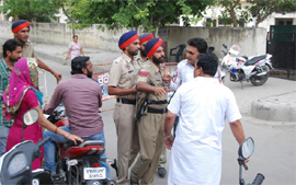 Policemen try to sort out a heated argument between the supporters of a contestant and a person who had come to cast his vote. 