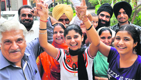 Manpreet in a jubilant mood with her family in Ropar on Thursday.