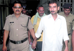 Convicted policemen in civvies.
