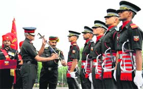 Lt. Gen Manvendra Singh, Commandant of the IMA, honours gentlemen cadets at the Commandants parade in Dehradun on Thursday. 