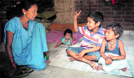 Jojo uses gestures to convey his message to his mother. He was reunited with family three months after he went missing, in Jammu on Thursday.