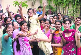 Rishu, who stood second in the PSEB Class XII exams, celebrates her success with her friends