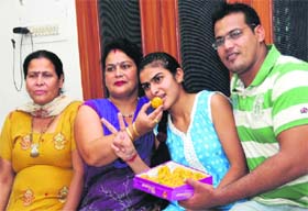 Nishu, who stood third in the PSEB class XII exam with her family members