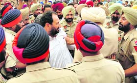 Former Congress MLA Madan Lal Jalalpur surrounded by policemen in Ghanaur