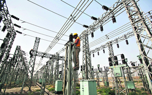 An employee works on electric pylons at a power station in Greater Noida. Arup Roy Choudhury, chairman of state-run NTPC, India's largest power producer, on Friday blamed the government for chronic fuel shortages that have exacerbated the country's energy crisis and put off steps to increase power generation.