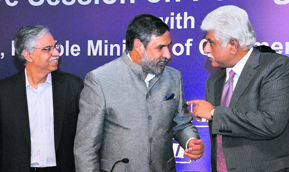 Commerce & Industry Minister Anand Sharma (C) with CII past president Sunil Kant Munjal (L) and industrialist Rakesh Bharti Mittal at a conference on issues related to foreign trade policy organized by CII in New Delhi