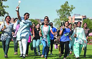 Class XII students of MSD School a jubilant mood following the declaration of results by the Punjab School Education Board, in Bathinda on Friday. 