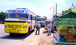 Residents have to wait for buses in scorching heat