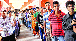 Students stand in a queue to buy prospectus at Government Model Senior Secondary School at Sector 19 in Chandigarh on Friday