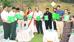 Agriculture Minister Mantri Prasad Naithani (wearing a cap) during the inauguration of the first organic restaurant of the country in Tera Gon village near Dehradun recently