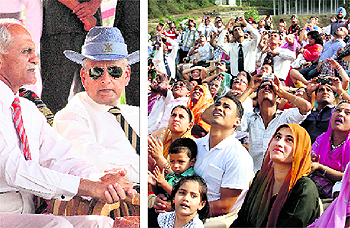 Admiral Nirmal Verma (wearing a hat), Navy Chief, watches multi-activity display; and members of the passing-out gentlemen cadets families enjoy the activities