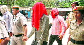 The accused in police custody.