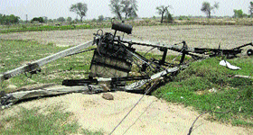 An uprooted transformer in a village in Fatehabad.