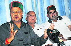 Union Minister for Small and Medium Enterprises Virbhadra Singh underscores a point at a press conference in Dharamsala on Friday