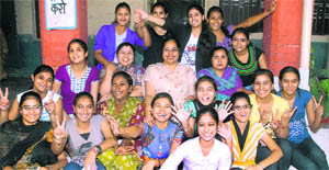 Toppers of Government Girls Senior Secondary School, Nehru Garden, celebrate their success in PSEB exams in the district. Also seen in the picture are principal (centre) and teachers. 