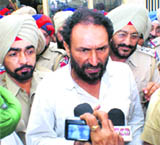 Former Congress MLA Madan Lal Jalalpur being taken to a court in Rajpura on Friday. 