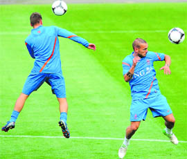 Netherlands Wesley Sneijder (R) controls the ball at a training session at Wisla Stadium in Krakow. Netherlands face Denmark in the opening game of Group B on Saturday. 