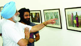 Artist Harpreet Singh during his solo exhibition in Amritsar. 