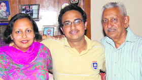 Shivam Garg and his parents.