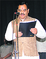 Harak Singh Rawat takes oath as minister at Raj Bhawan in Dehradun on Saturday