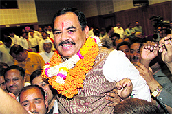 Rawat being felicitated by his supporters