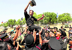 Gentlemen cadets rejoice after the passing-out parade at of the Indian Military Academy in Dehradun on Saturday
